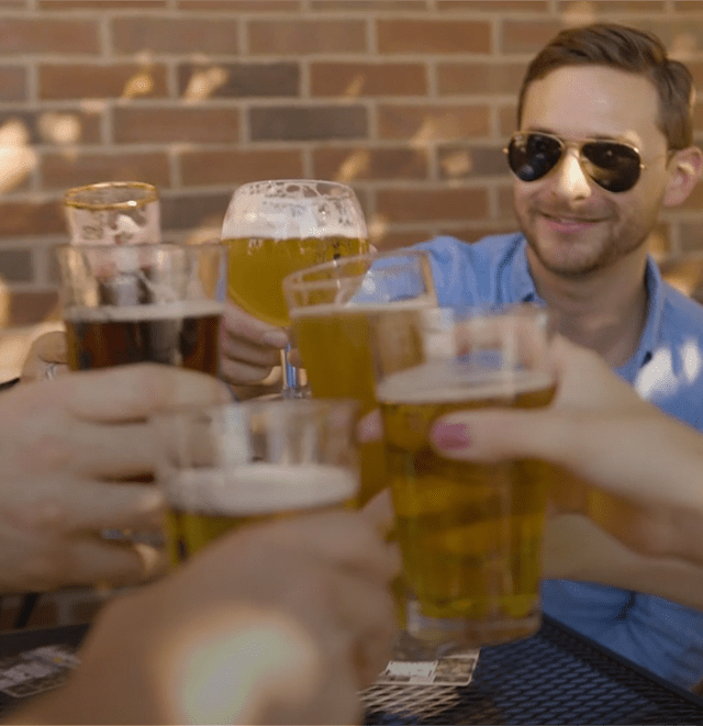 Leverage Team Cheersing Beers at Happy Hour