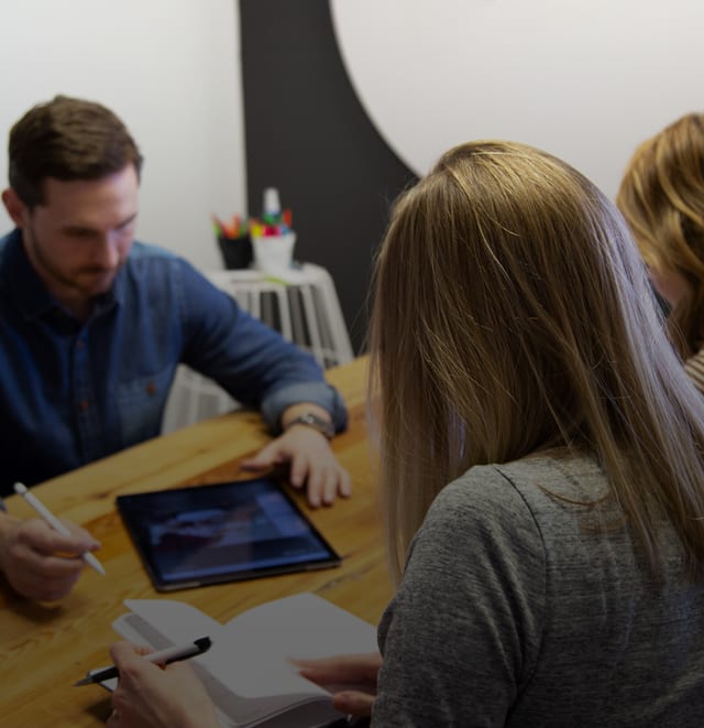 Brainstorming session to determine marketing tactics.
