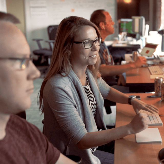 Two coders pair programming.