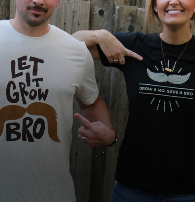 Leverage team members showing off Movember T-shirts.