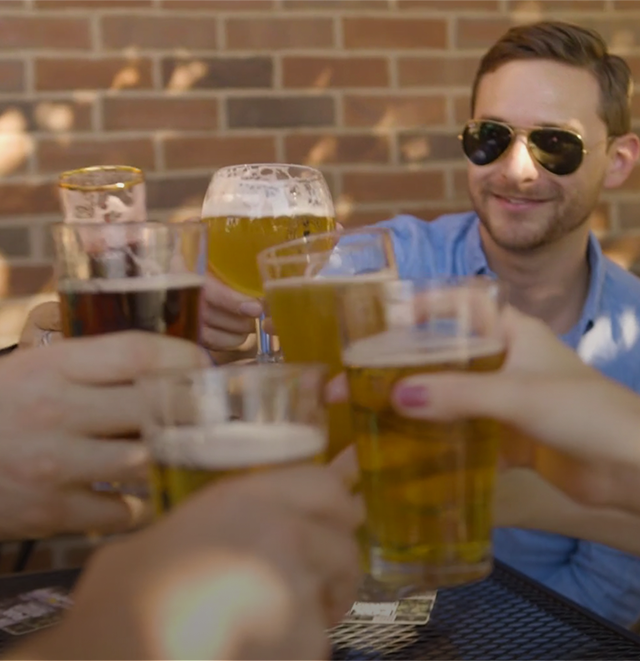 Leverage Team Cheersing Beers at Happy Hour