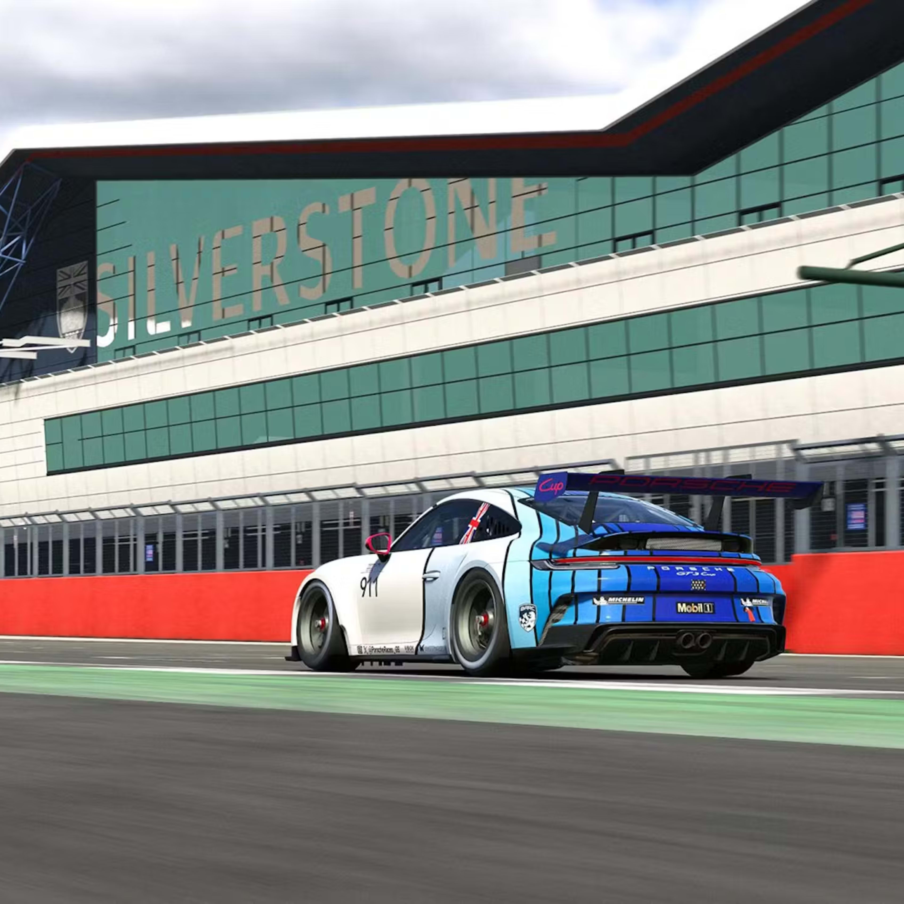 Rear view of a virtual 911 racing on Silverstone near the finish line