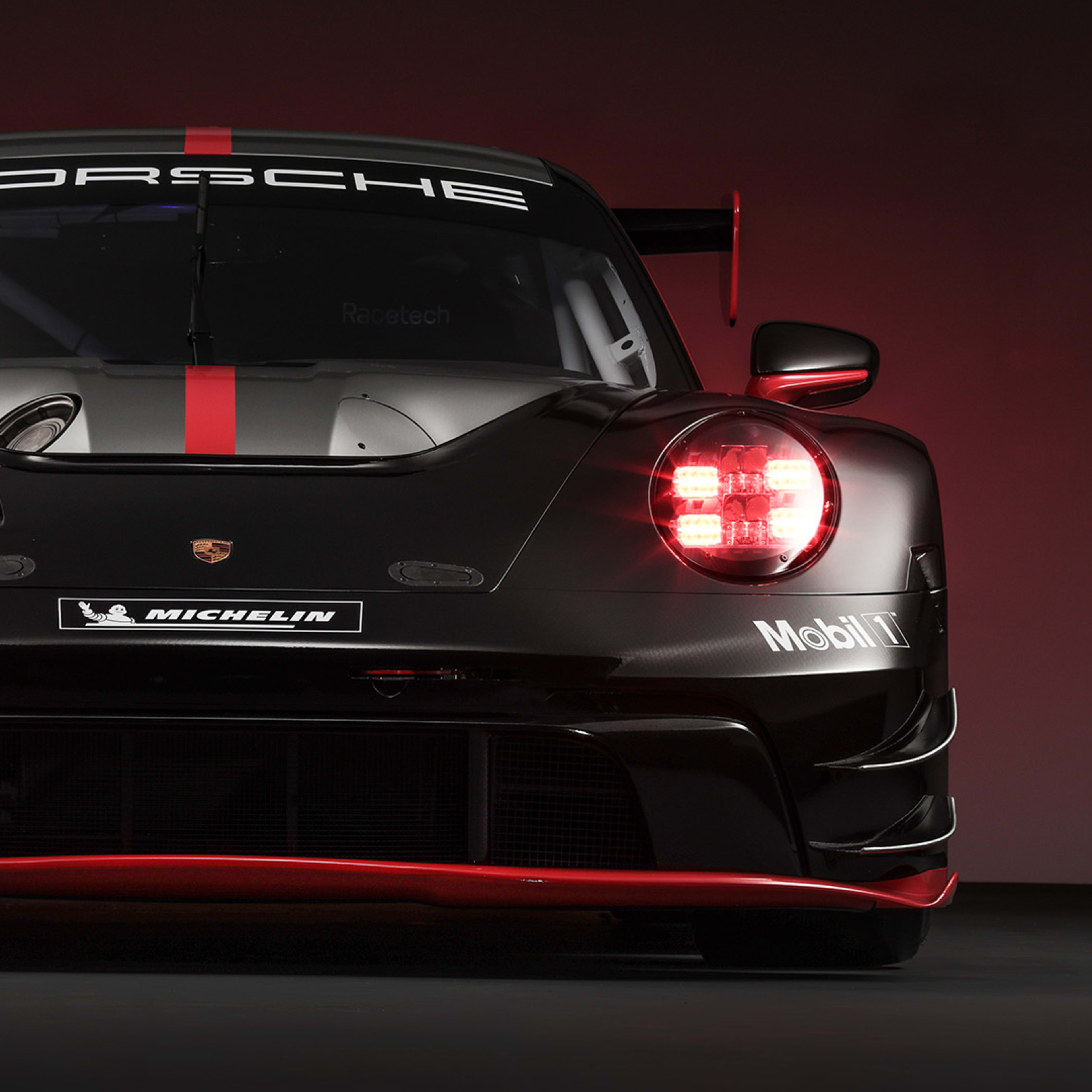 Porsche car with red lights from the front