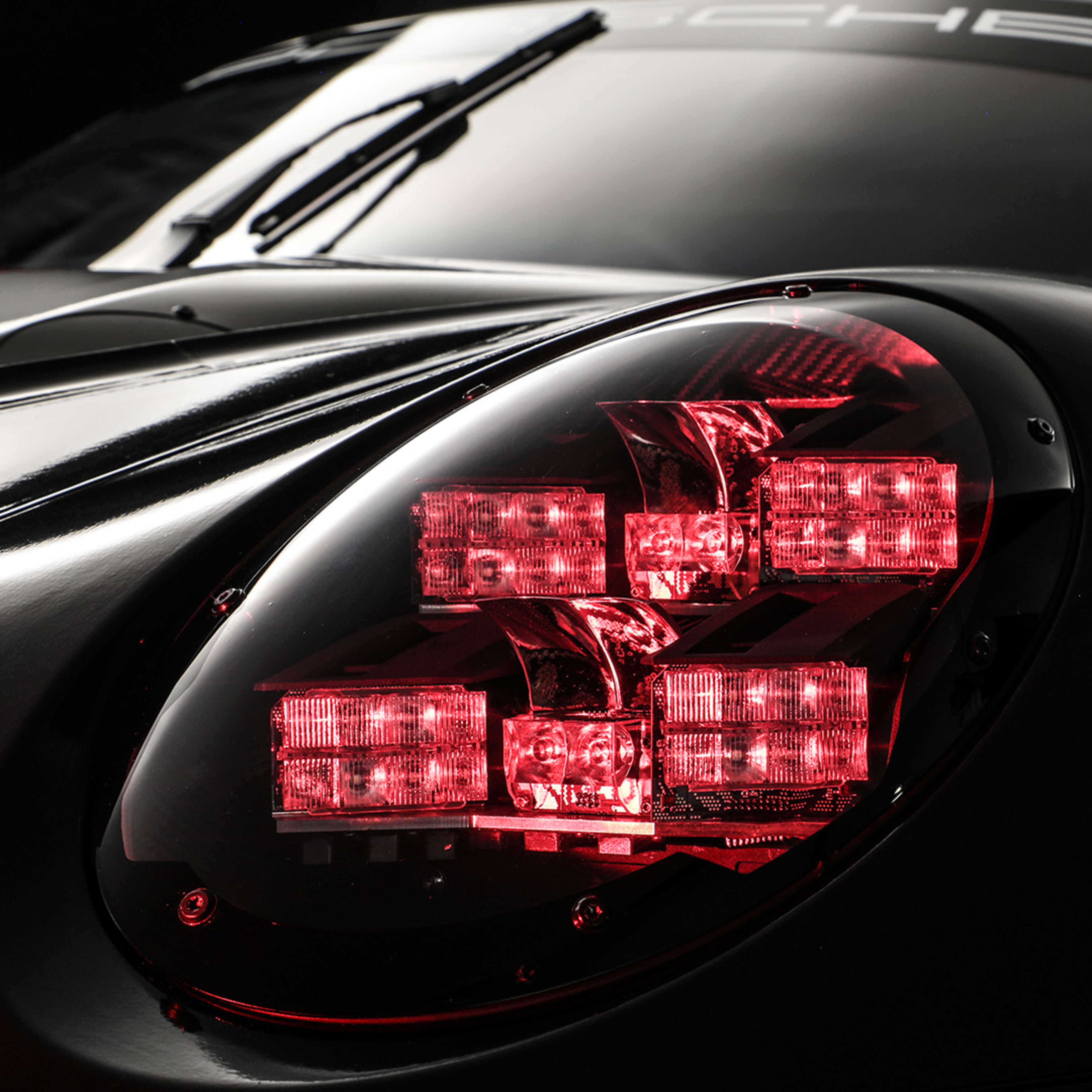 Close up from Porsche front light with red lights