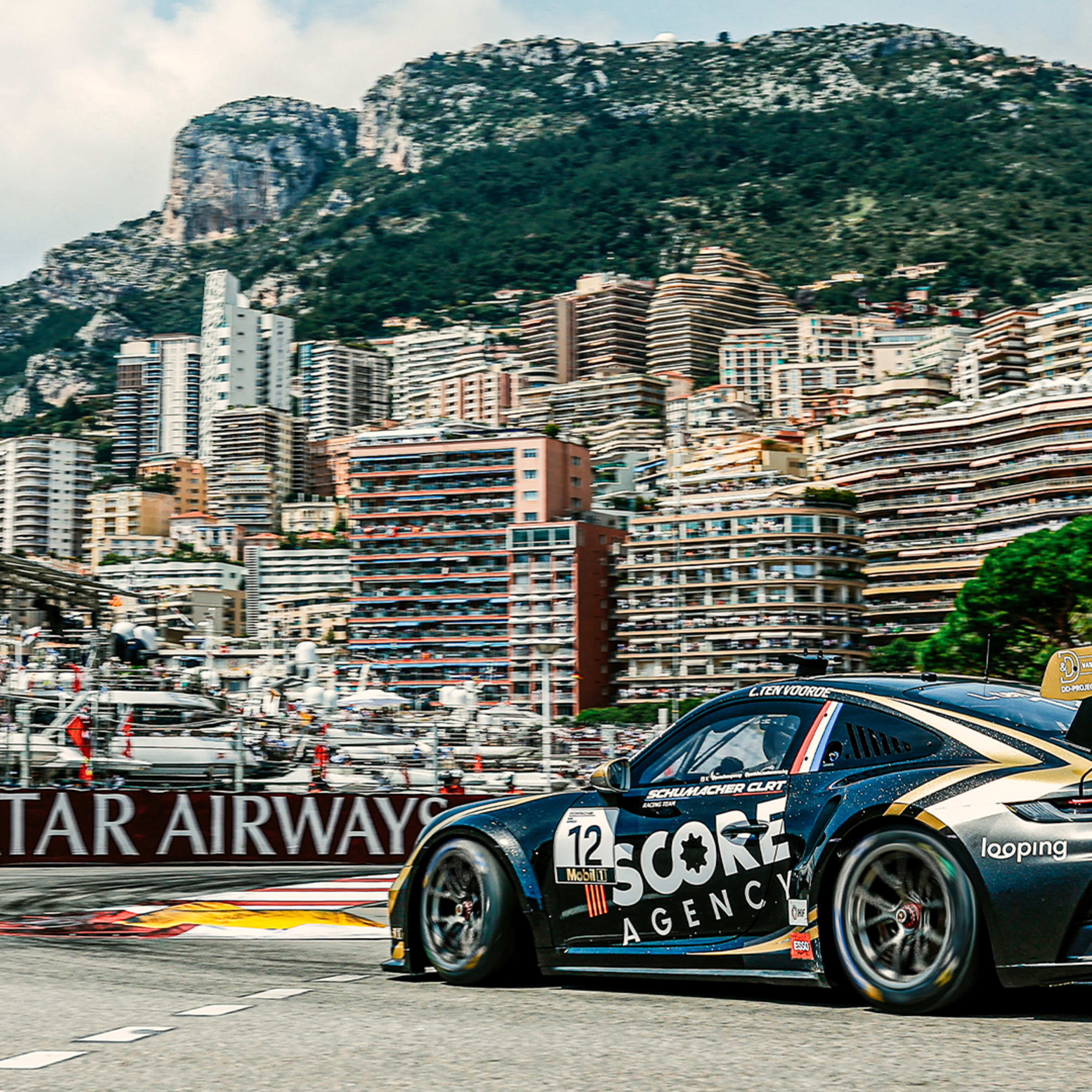 The black Porsche 911 GT3 Cup of Larry ten Voorde at the entry of the Nouvelle Chicane at the 2024 race on the legendary street circuit in Monaco