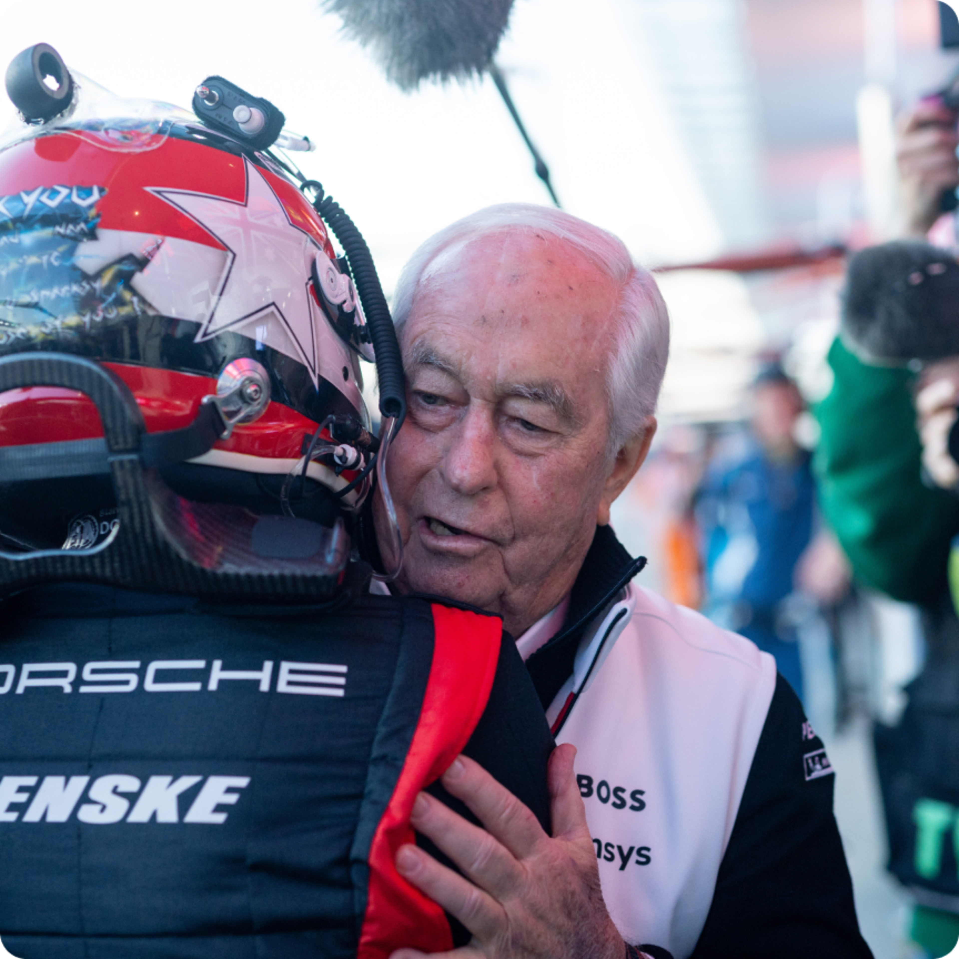 Driver and captain embracing