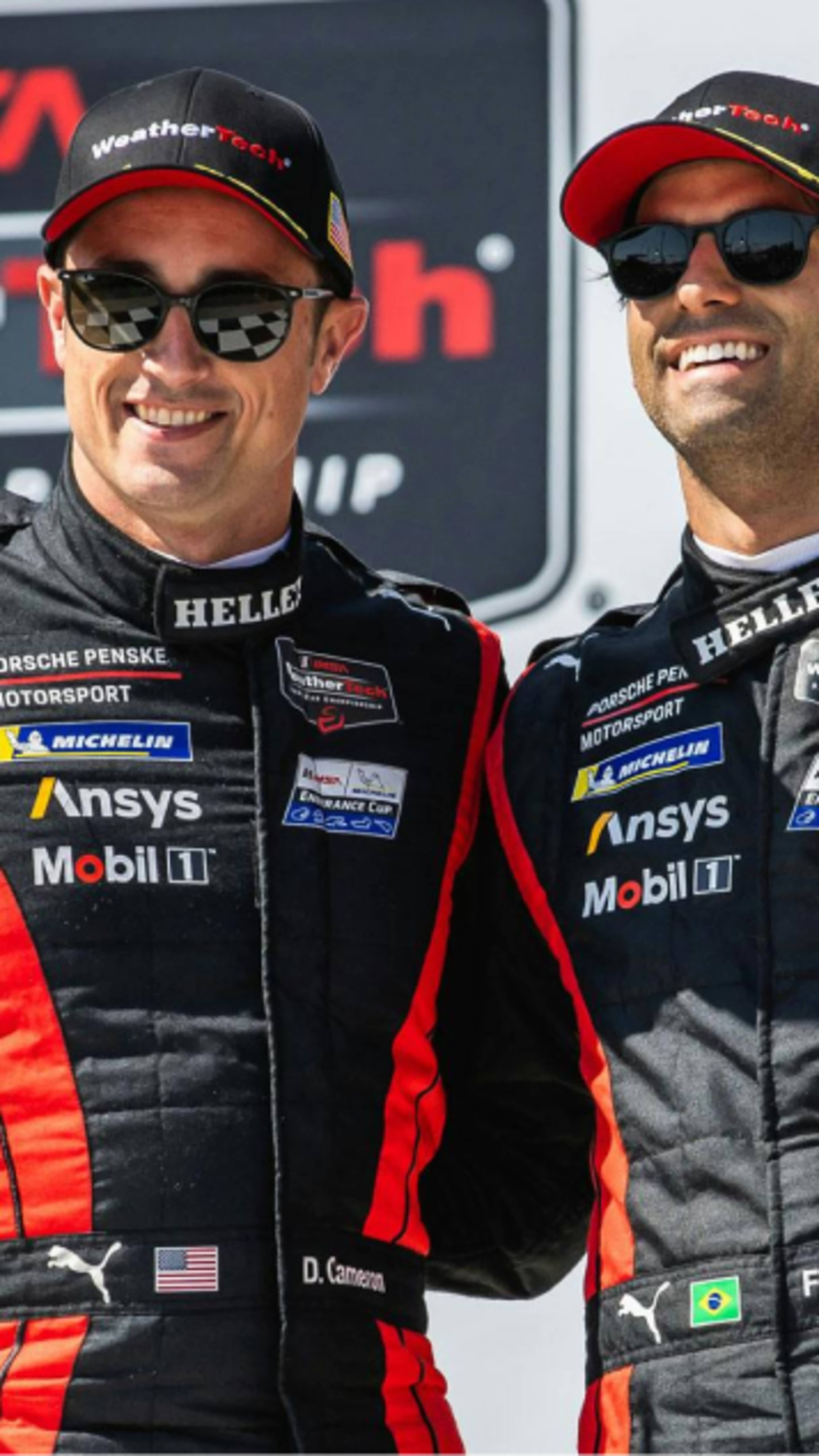 Dane Cameron and Felipe Nasr holding their trophies 