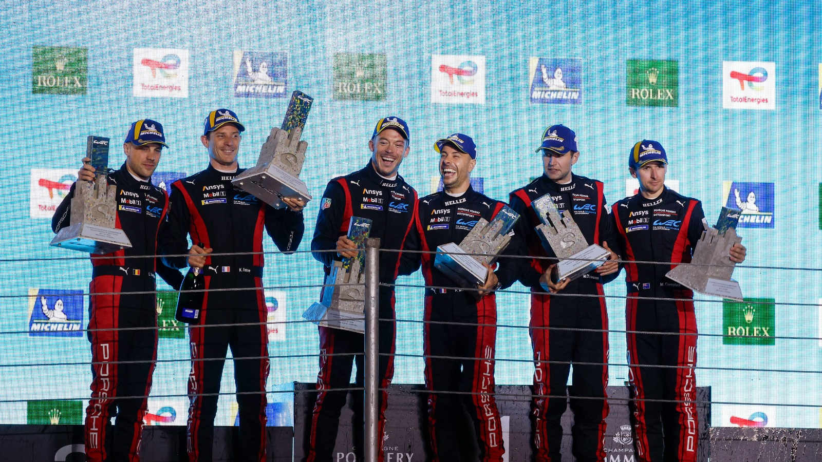 The #6 and #5 Porsche Penske Motorsport drivers on the podium for the 6 Hours of São Paulo