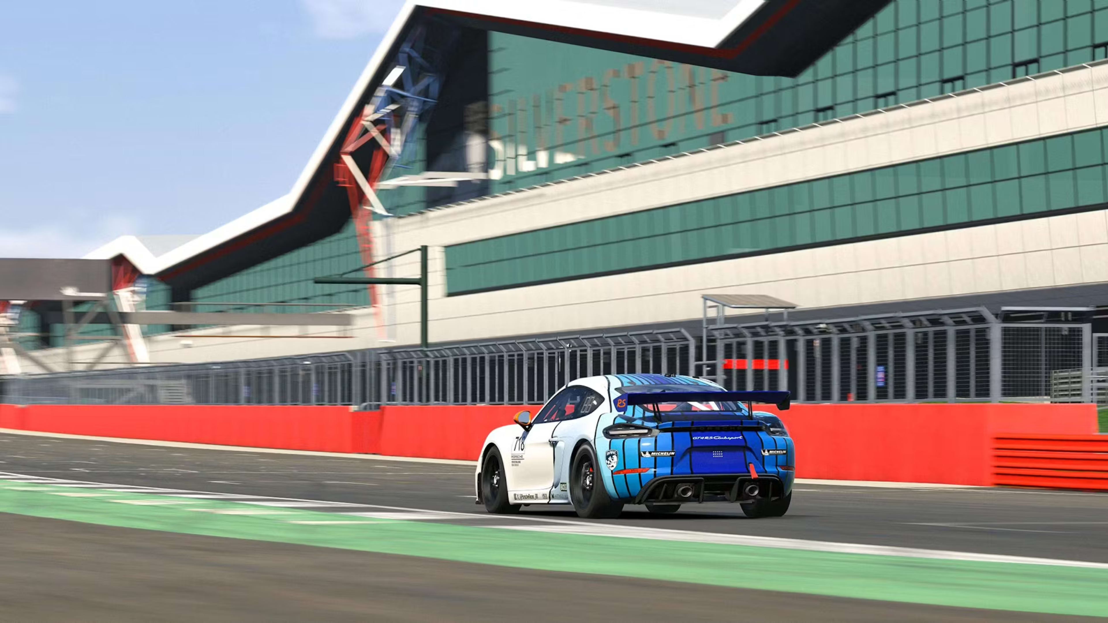 Rear view of a virtual 718 Cayman racing on Silverstone near the finish line