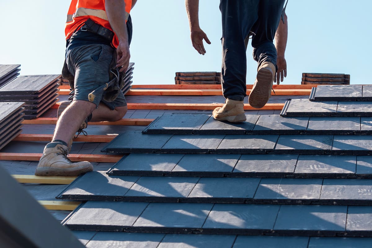 AM Norfolk Roofing Services Roofers installing roof tiles