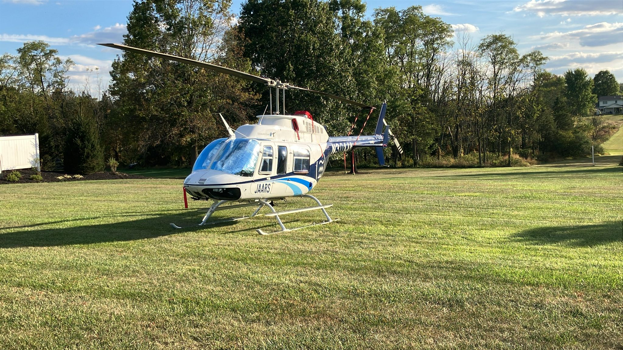 Helicopter parked in a field