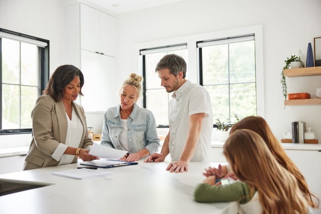 Homeowner reviewing multiple cash offers
