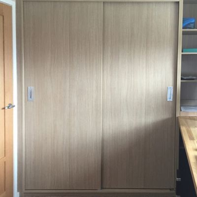 Scribe-in sliding door cabinet in Aragon Oak