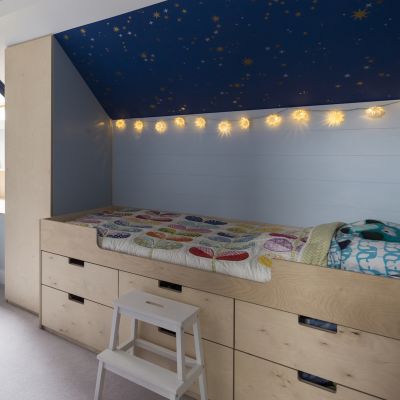Child bed with birch ply cabinetry underneath
