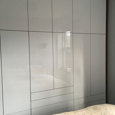 High gloss white wardrobe with walnut MFC carcass