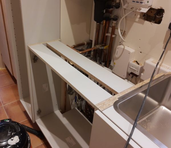 Utility cupboard under boiler installation