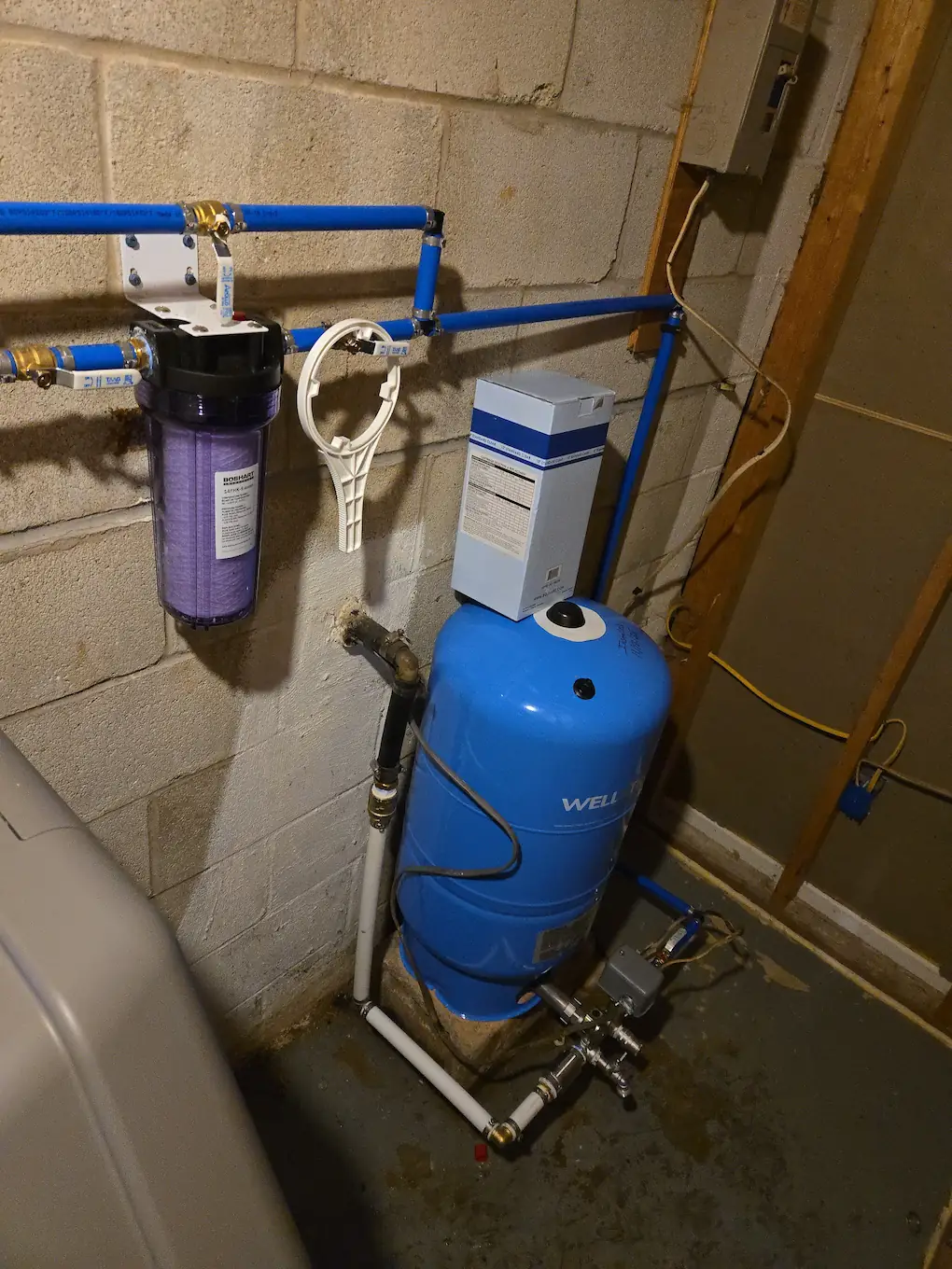 Well-X-Trol tank with bypassable sediment filter and labeled valves in a New Freedom basement