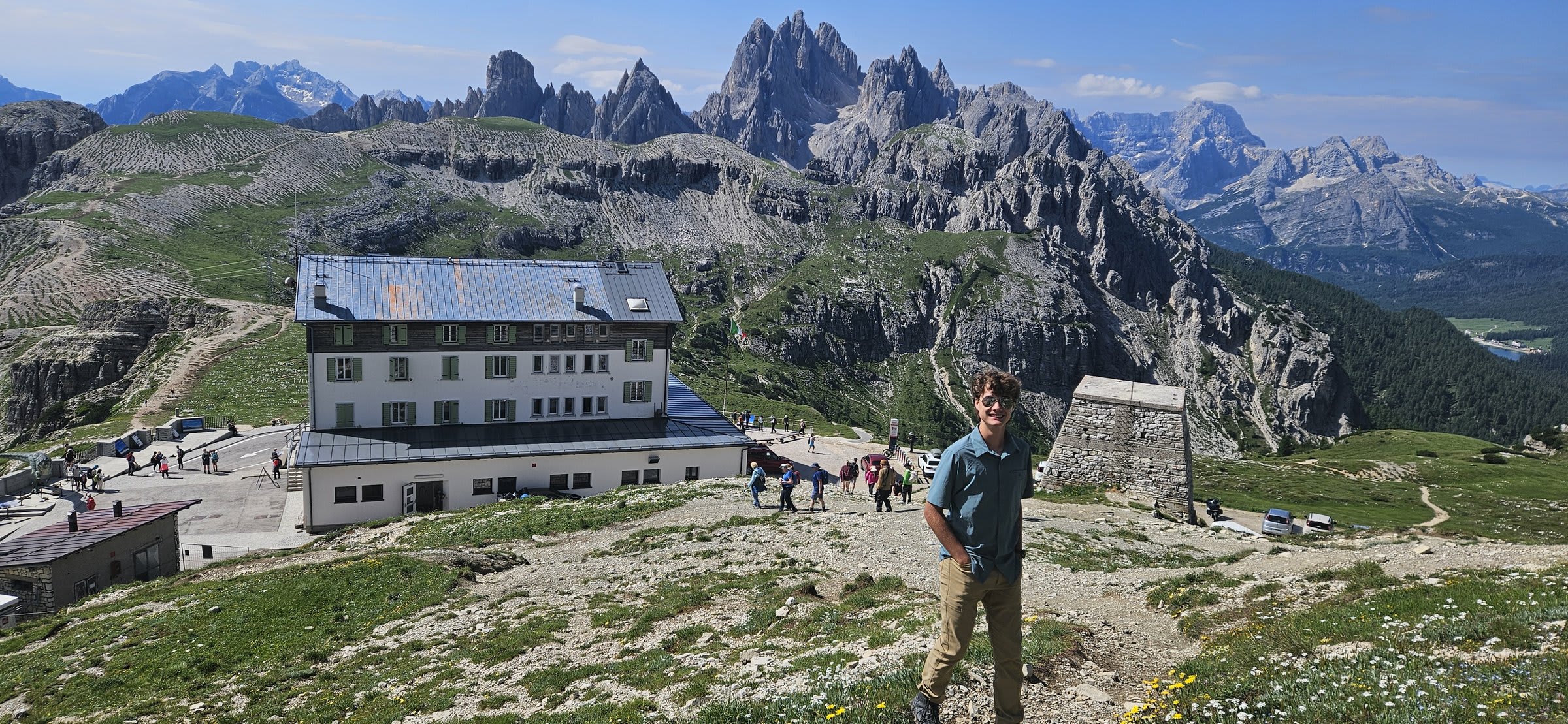 The iconic three peaks of Tre Cime emerging through gathering clouds