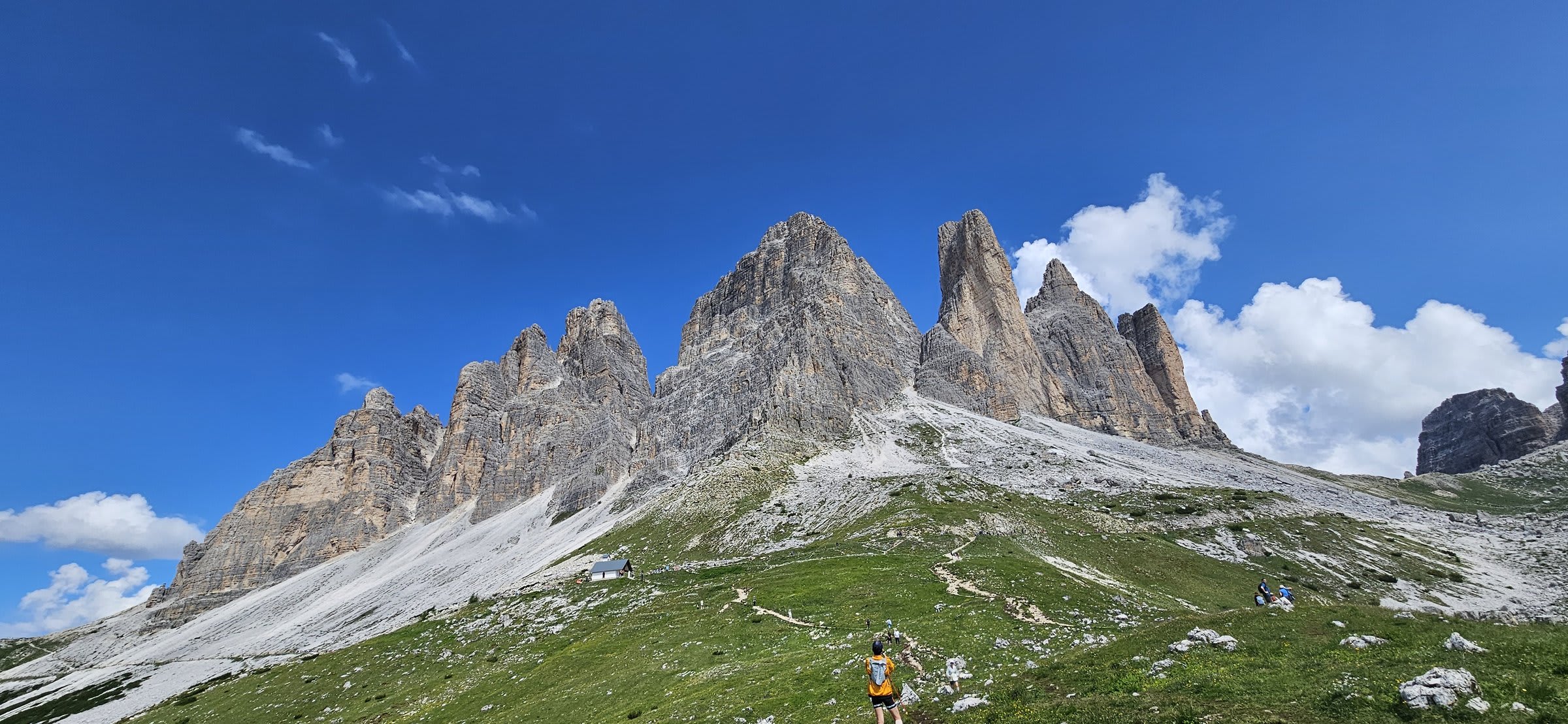 The winding road leading up to Tre Cime di Lavaredo with dramatic Dolomite peaks in the background0