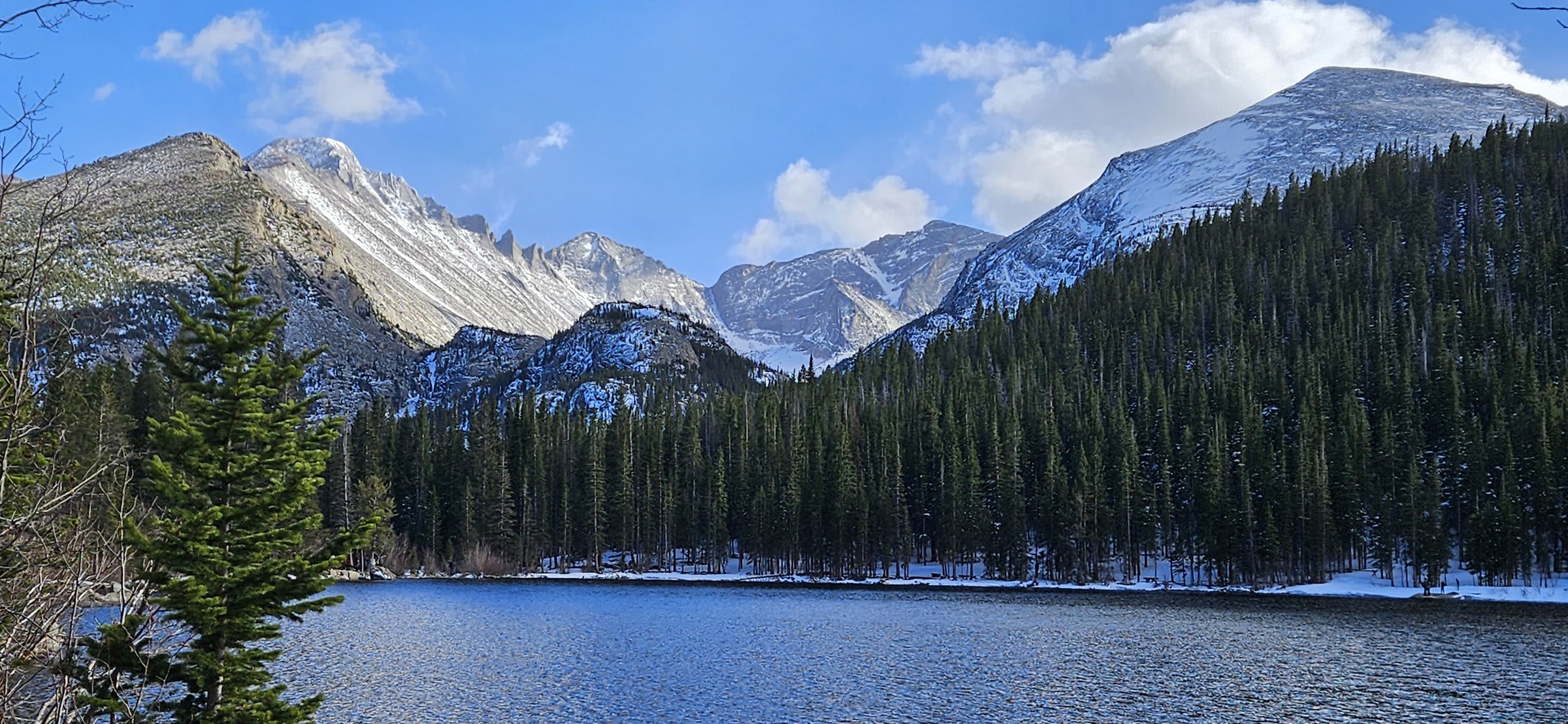 Snow-covered bridge crossing Glacier Creek in Rocky Mountain National Park