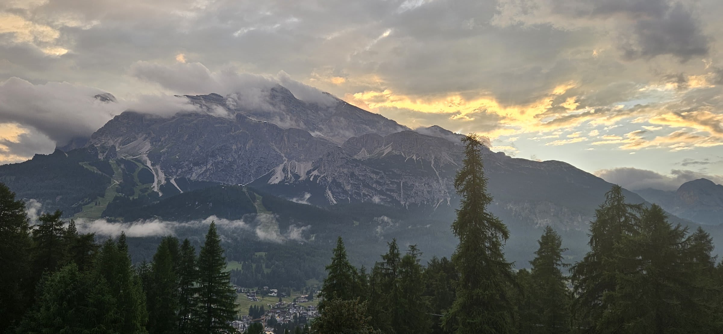 Golden sunset light illuminating the Dolomite mountains from our apartment