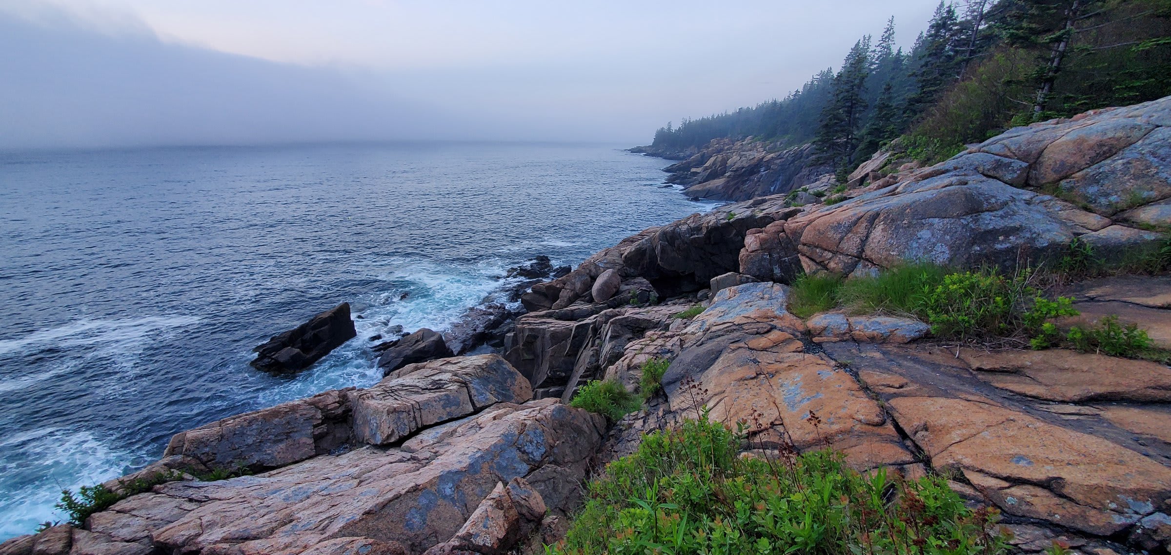 The smooth cobblestones of Little Hunter's Beach with waves rolling in