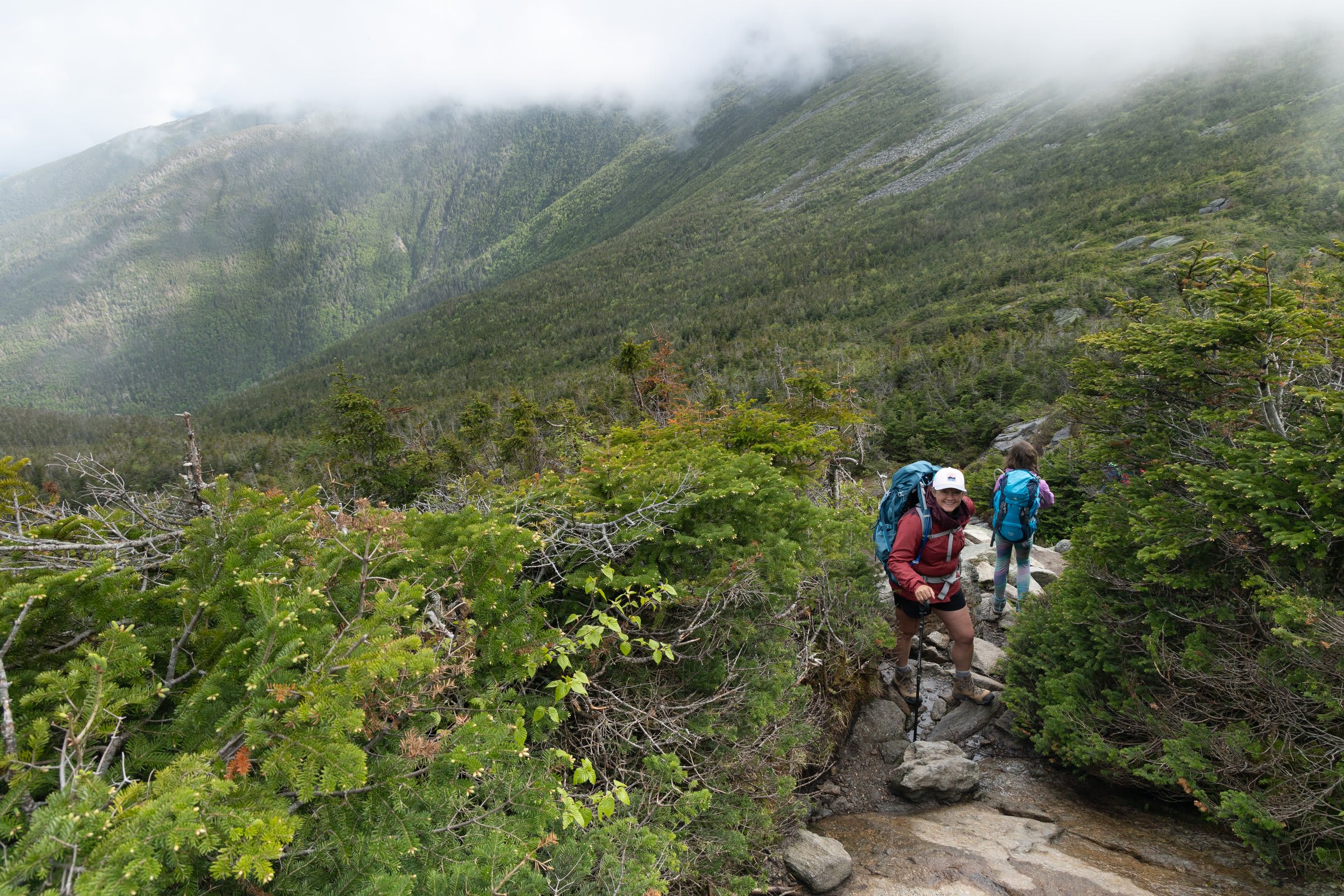 Rocky alpine terrain with distant peaks