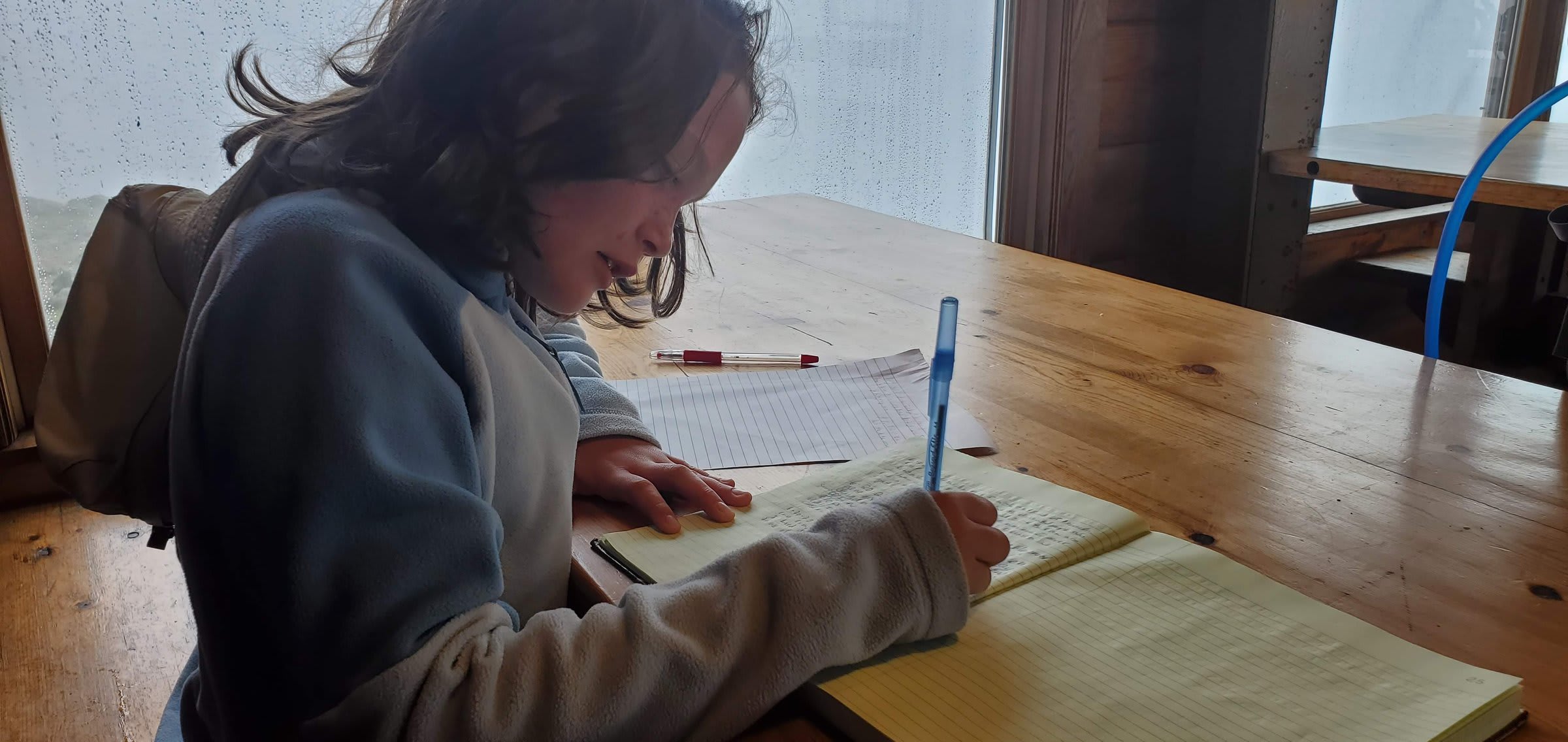 Writing in the hut logbook the next morning