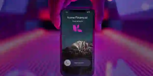 Hand holding iPhone from above, phone has an incoming call that is branded, the background is magenta