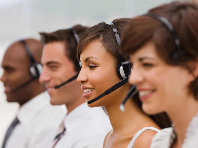 Happy call center workers receiving secure calls