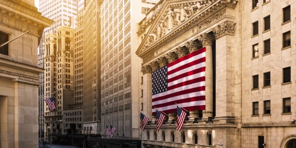 wall street and US Stock Exchange draped in American flags