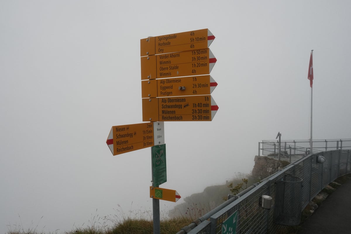 A Wanderweg route sign on top of the Niesen Kulm.