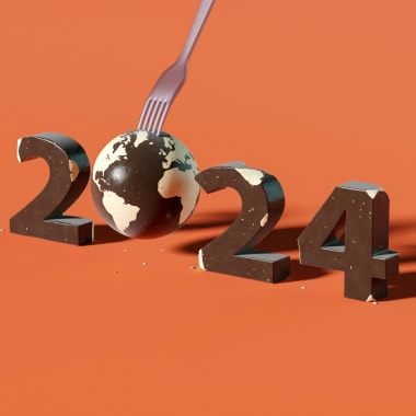 Year 2024 on orange background with world