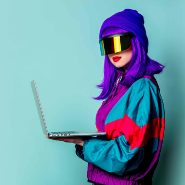 Woman with Purple Hair Holding Laptop