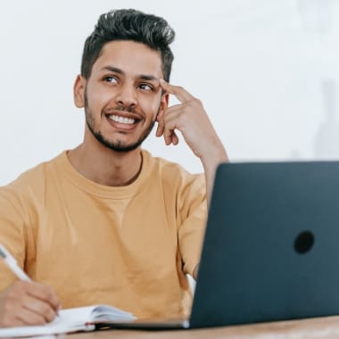 A man sitting at a desk and thinking