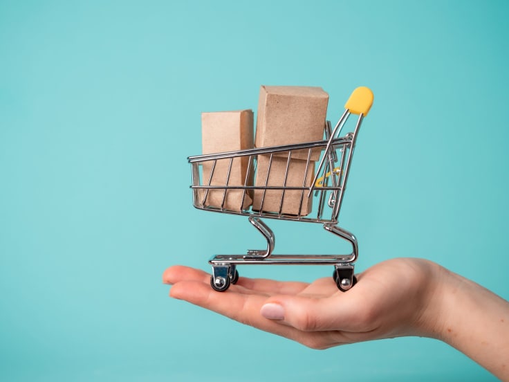 a shopping cart with paper boxes