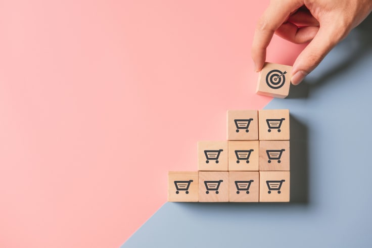 wooden blocks with shopping carts icons