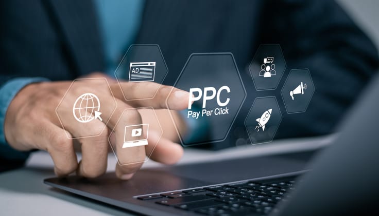 Pay per click PPC concept. Advertising in Search Engine Platforms. Digital Marketing Strategies and Goals. Businessman using laptop with PPC icon on virtual screen.