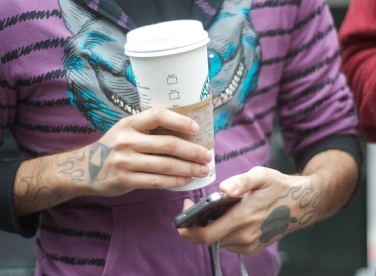 Apple fan with Starbucks coffee