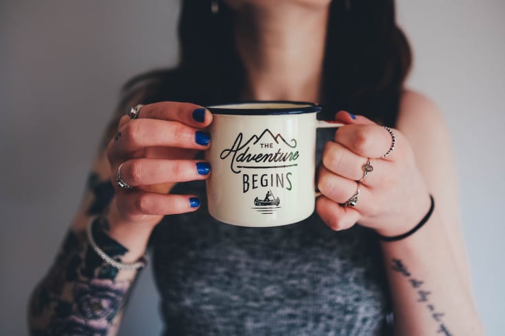 adventure begins cup hold tattooed girl woman