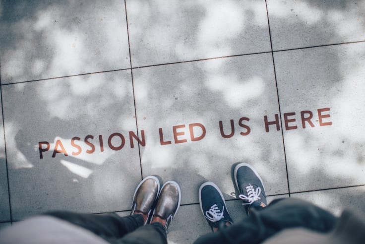 passion led us here sign pavement