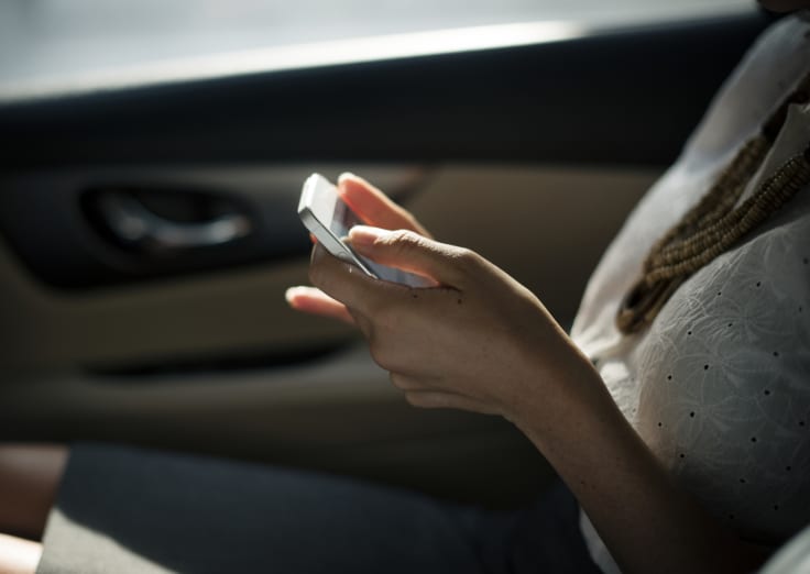 SMS text messaging woman in car