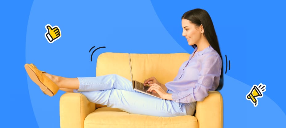 a lady sitting on a couch and writing on the computer