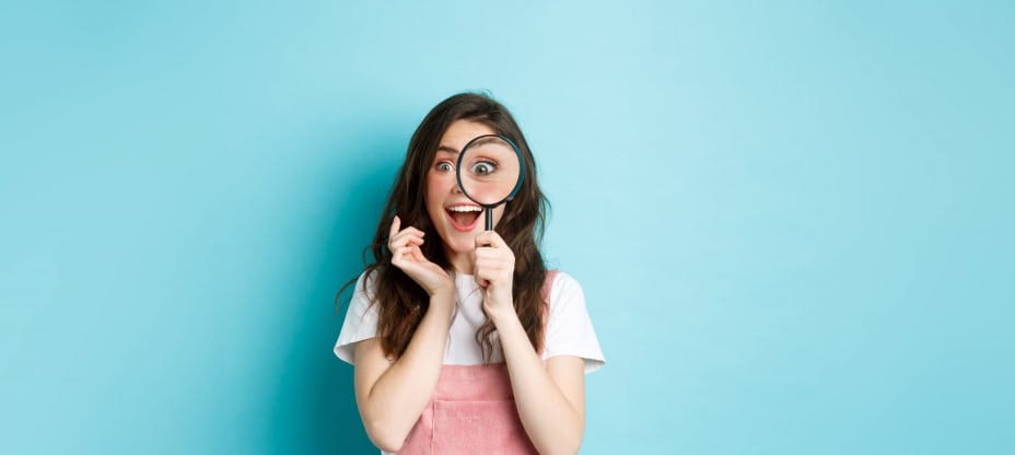 a girl with a reading glass