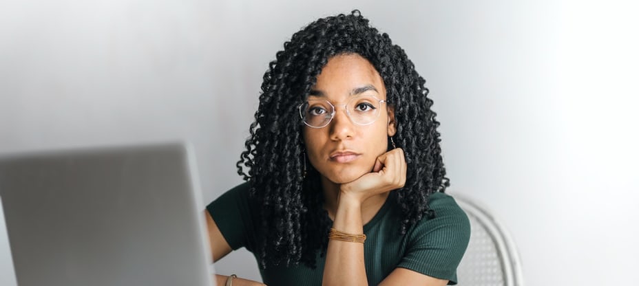 a woman sitting in front of computer