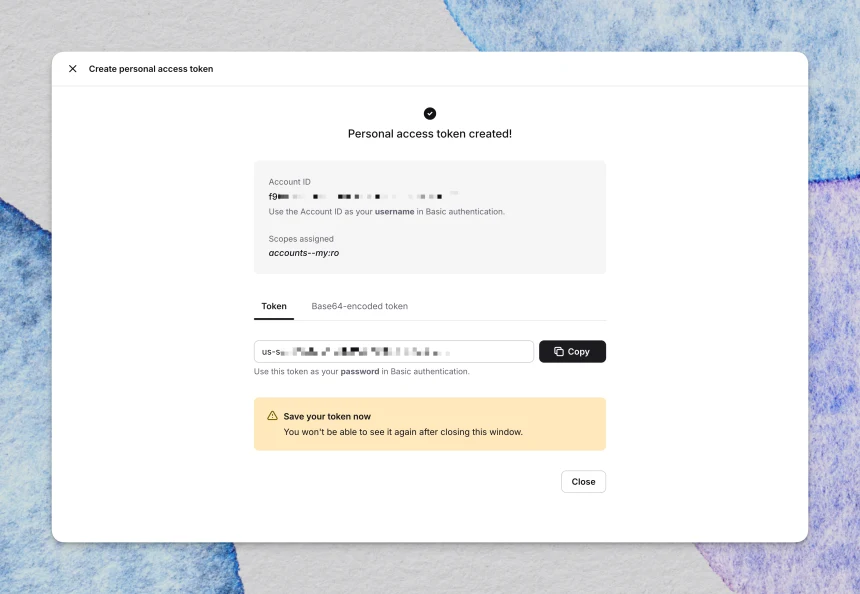 Personal access token created confirmation, showing the Account ID, assigned scopes, and token value with a Copy button.