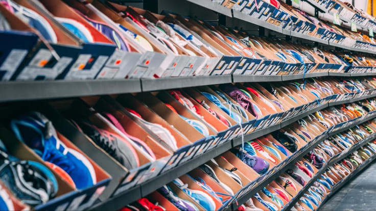 shelves with dozens of running shoes