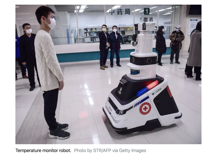 the man in the mask interacting with a medical robot