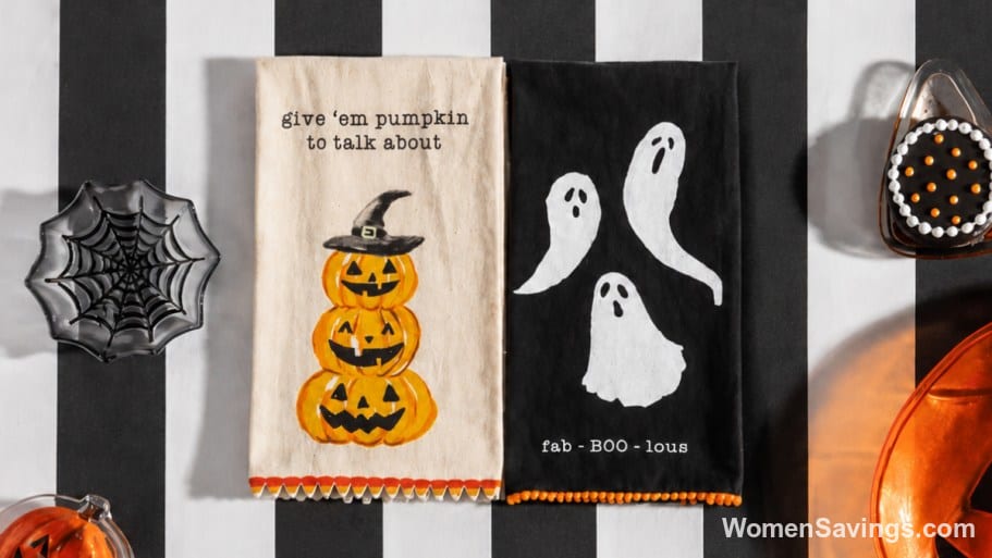 Mud Pie Halloween and holiday decor including a jack-o-lantern towel, pillar candle and mini pillows on sale