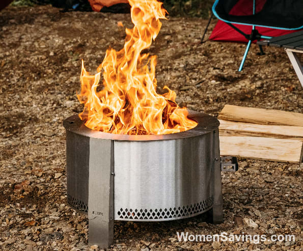 Camping scene with a portable Solo Stove fire pit and roasting sticks at a Thousand Trails campground in fall